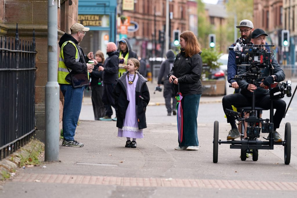 Behind the scenes on Govan Fair Queen: cast and crew on a Govan street with a camera rig